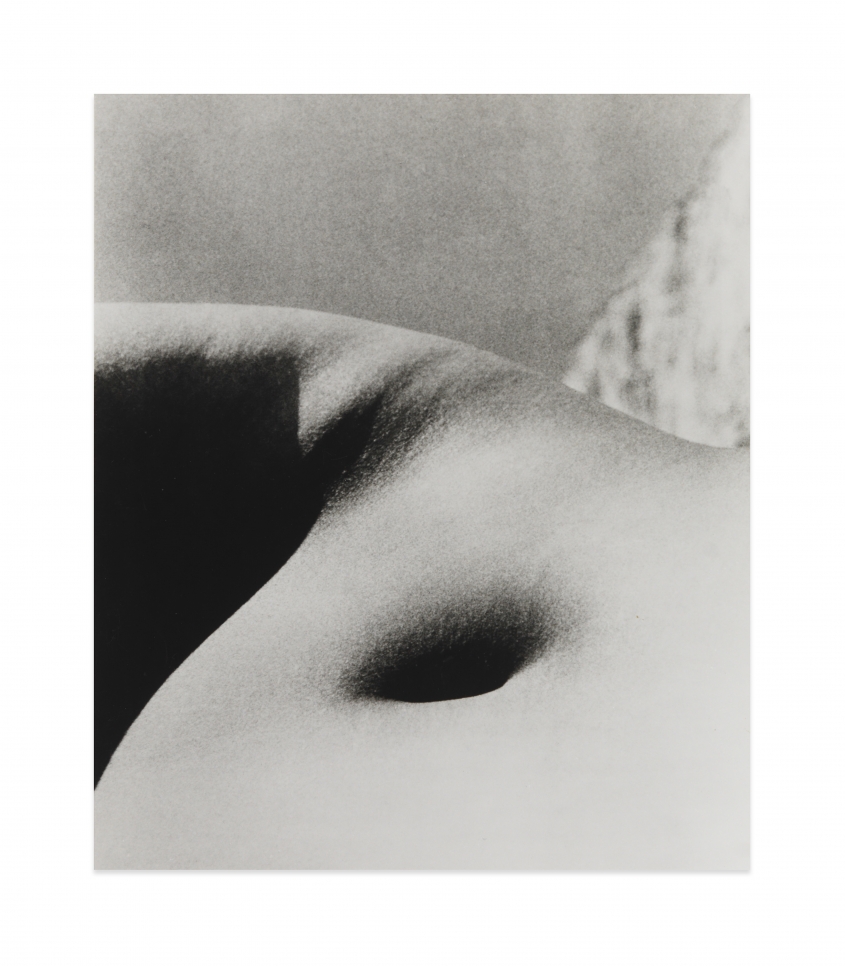 Black and white photograph by Bill Brandt showing the bellybutton of a nude figure